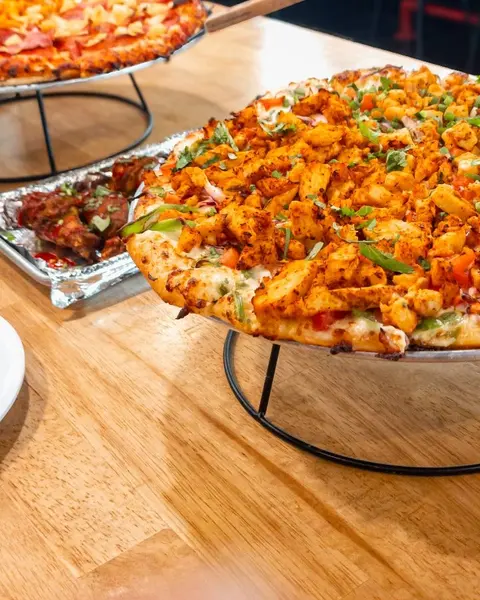 Instagram post by @nowbeingserved for Curry Pizza House